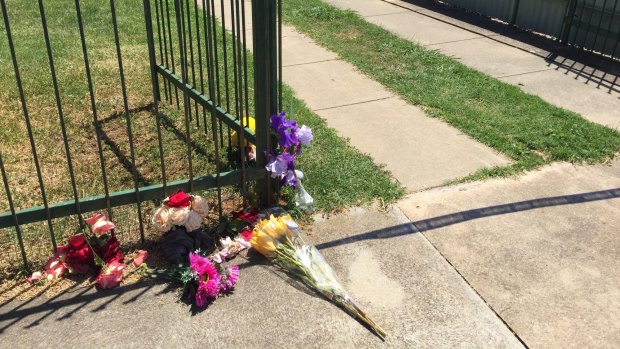 Flowers outside the Wangaratta home where an 11-year-old girl was found dead.