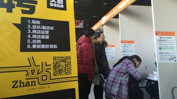 Job seekers at an employment fair in Beijing. 