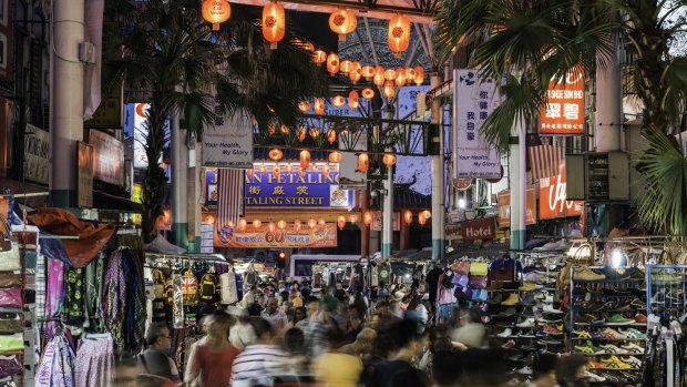 Kuala Lumpur's Chinatown night market busy with shoppers.