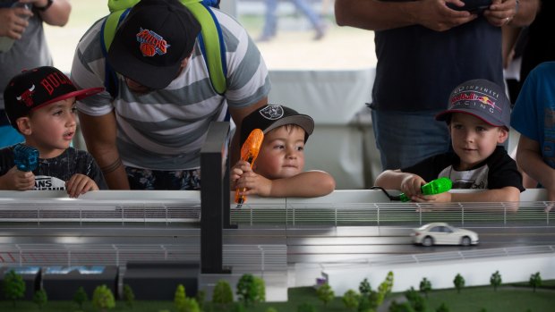 Jaques, Remy and James enjoy the slot car racing at the Australian Formula One Grand Prix.