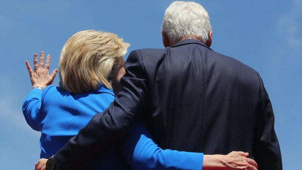 Hillary Clinton and former president Bill Clinton embrace.