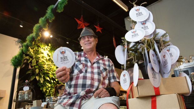 Rob Holt at The Farm Whole Foods in Potts Point, one of the many stores you can buy a cardboard plate for $15 that goes to feeding one person on Christmas day.