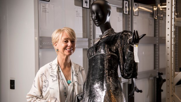Museums Victoria CEO Lynley Marshall with a couture Prue Acton gown from 1985, part of Melbourne Museum's new Inside Out exhibition.