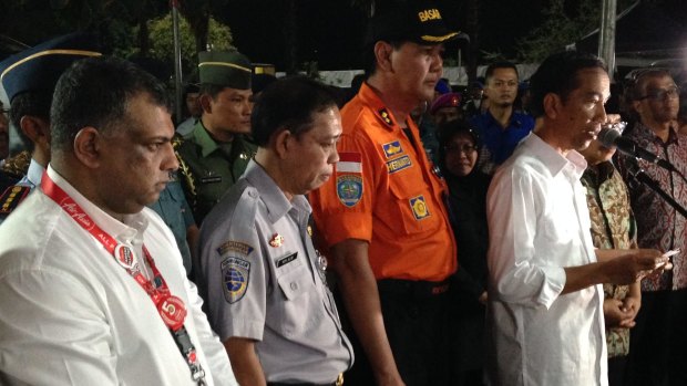 Indonesian President Joko Widodo (right) addresses the media at Surabaya airport on Tuesday night.