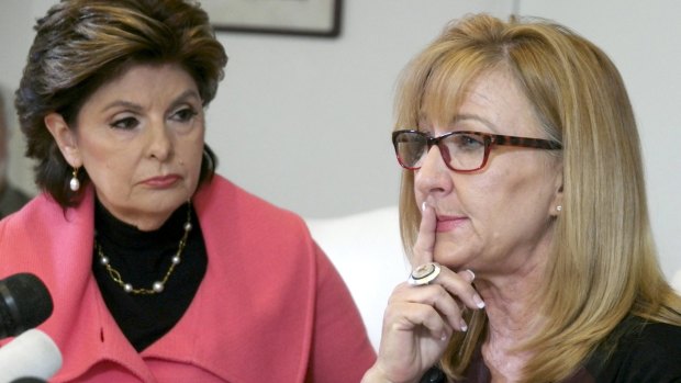 Attorney Gloria Allred listens as Janice Baker Kinney speaks during a news conference with three women alleging comedian Bill Cosby victimized them.