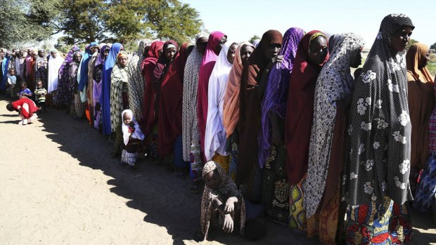 Women who have fled violence in Nigeria queue for food at a refugee welcoming centre in Ngouboua, Chad.