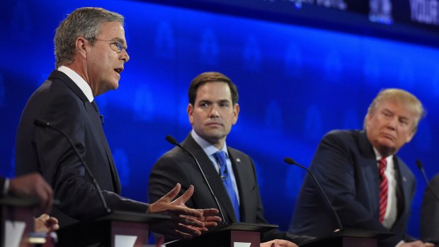 Jeb Bush, left, and Marco Rubio, centre, argue a point as Donald Trump looks on during the CNBC Republican presidential debate in Boulder, Colorado, on Wednesday. 