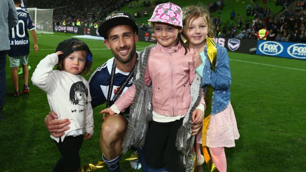 Carl Valeri of the Victory celebrates with his children after the Victory defeated Sydney FC in the 2015 A-League Grand Final match between the Melbourne Victory and Sydney FC at AAMI Park on Sunday night.
