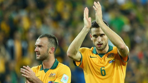 Matthew Spiranovic (right) expects Australia's defence to be much better in the game against Oman on Tuesday.