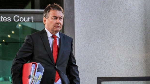 Former Solicitor-General Walter Sofronoff QC leaves the Brisbane Magistrates Court on the first day of the Royal Commission into Institutional Responses to Child Sexual Abuse.