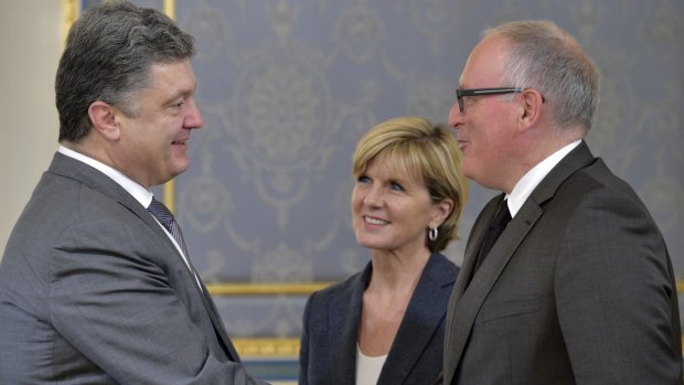 Ukrainian President Petro Poroshenko, left, meets with Netherlands Foreign Minister Frans Timmermans, right, and Australian Foreign Minister Julie Bishop in Kiev.