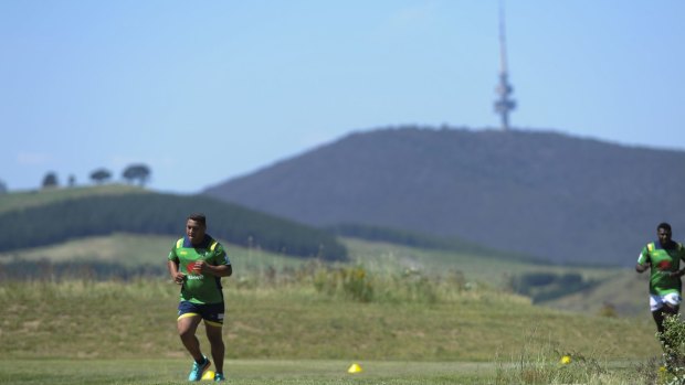 Josh Papalii and Edrick Lee on the running track at Stromlo Forest Park.
