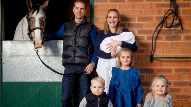 Horse trainer Matt Dale with Amy, one-week-old Lara, (front, l-r) Billy, 1, Amelie, 5, and Bella, 3. 
