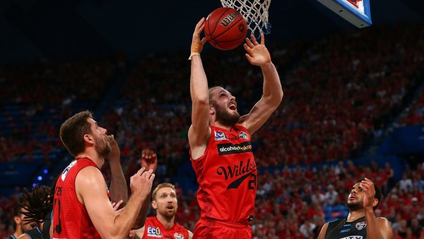 Jesse Wagstaff of the Wildcats gathers a rebound during game one of the NBL Grand Final series against the New Zealand Breakers at Perth Arena on Wednesday night.