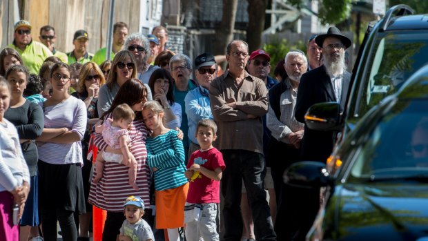 Mourners gather over the Bourke Street death of 10 year old Thalia Hakin