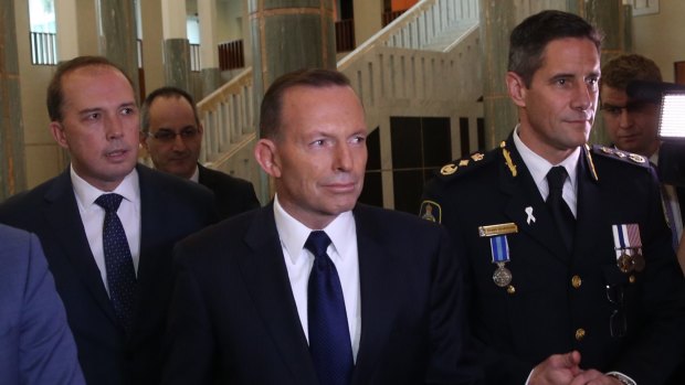 Immigration Minister Peter Dytton, Prime Minister Tony Abbott and Australian Border Force Commissioner Roman Quaedvlieg.