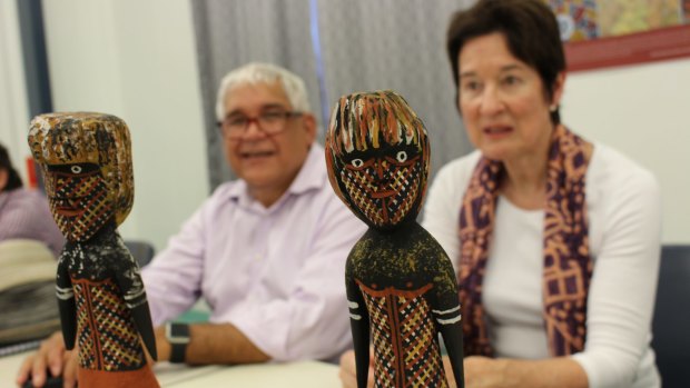 Royal Commissioners Mick Gooda and Margaret White with Tiwi totemic statues.