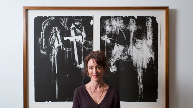 Curator Petra Kayser with 'Negative Tools', one of 249 works given to the NGV by US artist Jim Dine.  