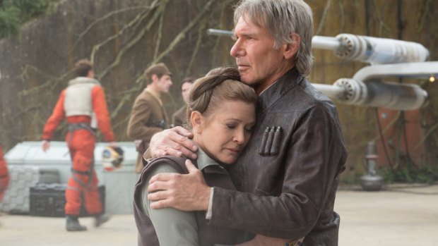 Wearing well ... Harrison Ford in THAT jacket comforts Leia (Carrie Fisher) in <i>Star Wars: The Force Awakens.</i>
