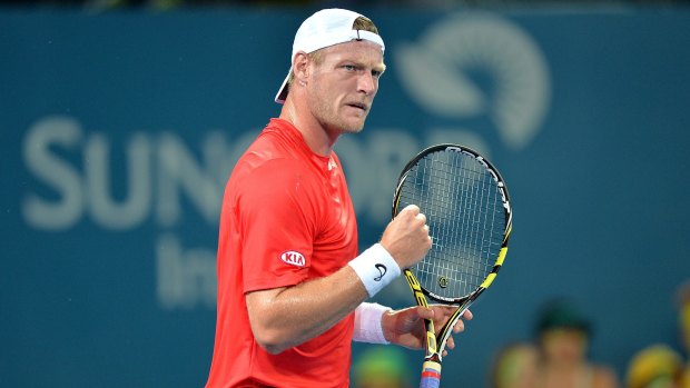 Sam Groth pumps his fist after winning the first set against Lleyton Hewitt.