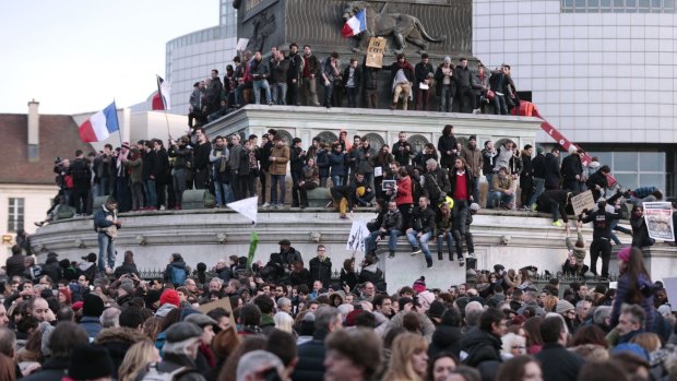 Outpouring of emotion: People come together at the Place de la Bastille for a unity rally on January 11 after the three-day killing spree by homegrown terrorists.