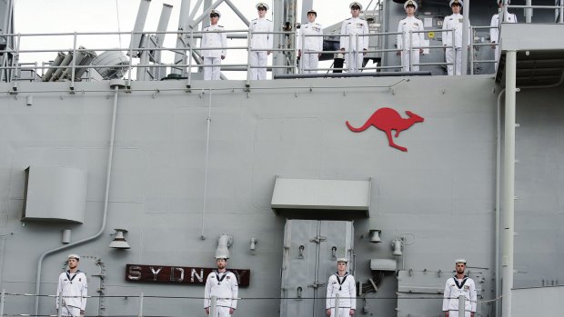 The ship's company stood to attention as the white ensign was lowered for the last time.