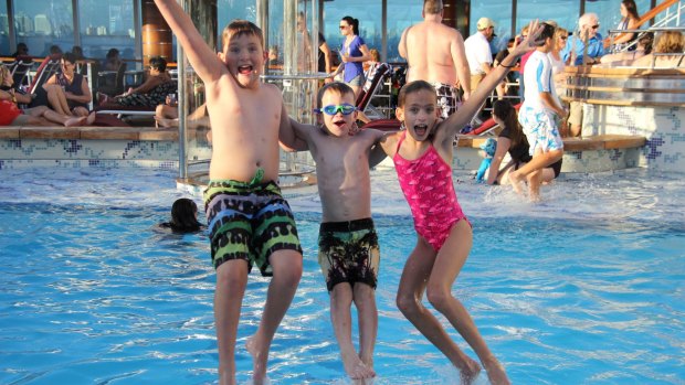 Kids from the extended cruising families enjoy their time in a cruise ship pool: Matthew Dresselhaus, Steele Wallace and Ella Dresselhaus.
