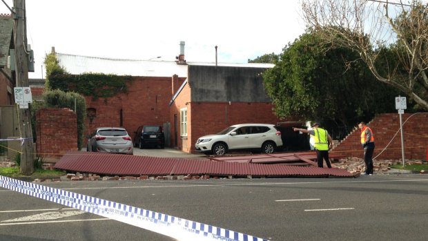 A brick wall collapsed in Flemington, closing a street.