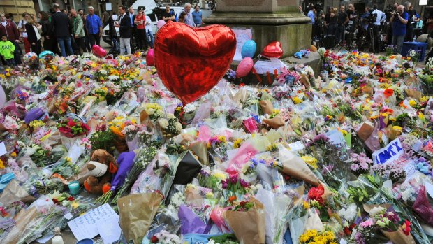 Floral tributes and messages on display for the victims of the concert blast, at St Ann's Square in central Manchester.