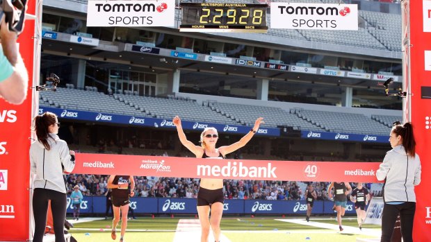 By a distance: Celia Sullohern took a break from triathlon to win the Melbourne marathon on Sunday.
