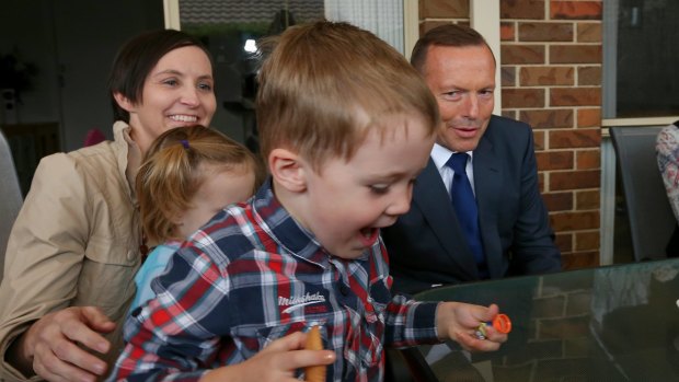 Prime Minister Tony Abbott meets Amaroo mother Skye Mendl and her children Austin and Evelyn on Monday.