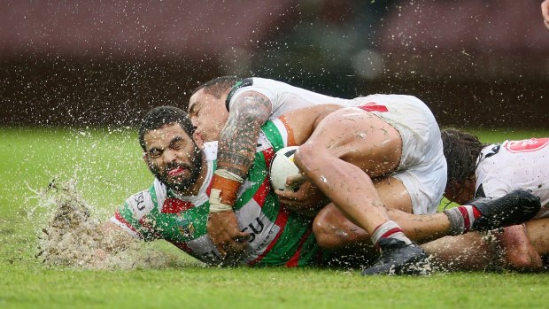 Making a splash: The Dragons show Greg Inglis what they learnt at training..