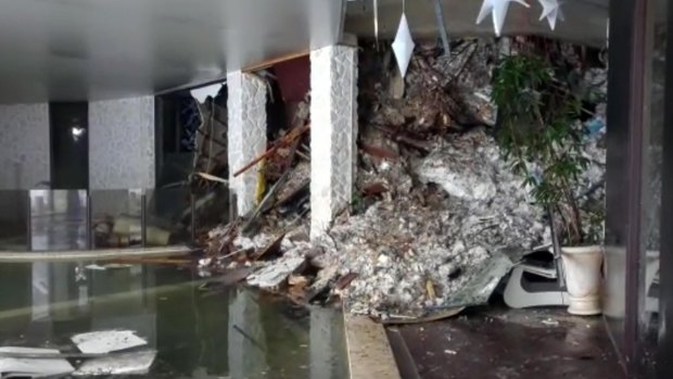 Piles of snow and rubble cascading into the foyer of the hotel Rigopiano after an avalanche.