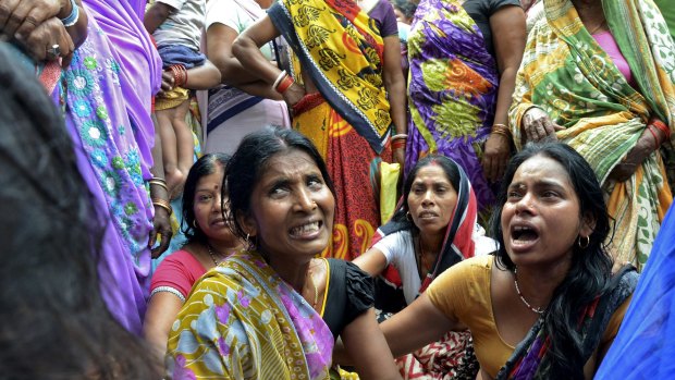 Women mourn the death of their relative who died in Bihar, India after a wall collapsed in Tuesday's 7.3-magnitude earthquake in neighbouring Nepal.