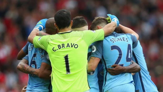 Party time: City players celebrate the derby win