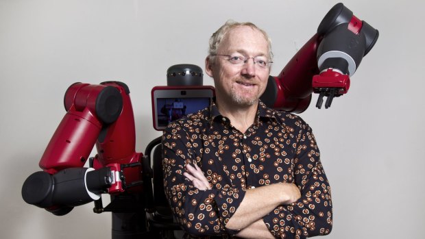 UNSW Professor Toby Walsh with a much friendlier, industrial robot called Baxter. The professor was a major driving force behind the open letter calling for a ban on killer robots.