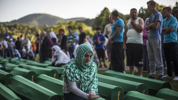 A woman mourns a victim of the 1995 Srebrenica massacre at the Potocari cemetery where the newly-identified remains of another 136 victims will be buried on Saturday.