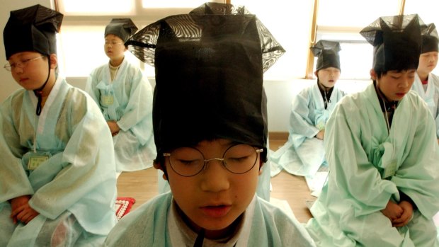 South Korean elementary school children study Confucian morals and manners at a winter camp north of Seoul.