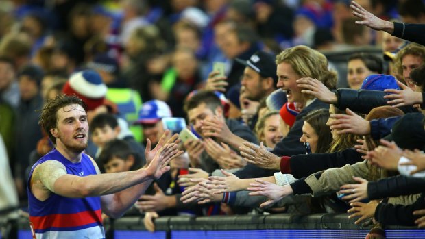Jordan Roughead celebrates with Bulldogs fans after their victory.