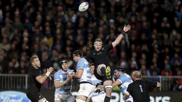 Chaos: Kieran Read contests the ball with Argentina's Manuel Carizza.