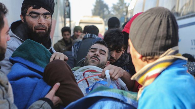An injured Syrian arrives at a refugee camp in Rashidin, near Idlib, Syria, following evacuation from Aleppo.