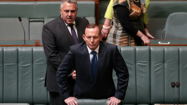 Treasurer Joe Hockey and Prime Minister Tony Abbott arrive for the condolence motion for Don Randall.