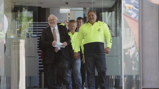 CFMEU organiser John Lomax, right, leaves the court with lawyer John Agius after having a blackmail charge dropped.