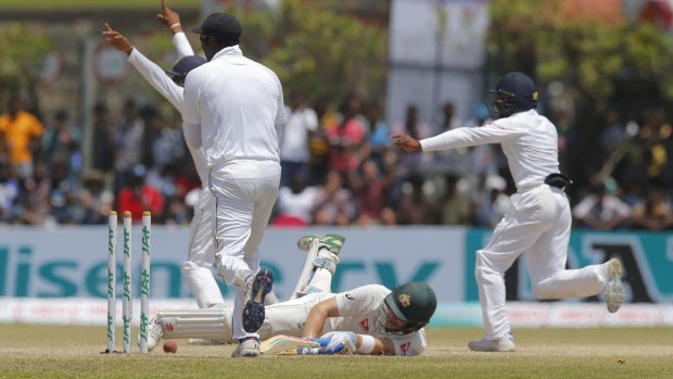 Nevill is run out in Galle as the Sri Lankans celebrate their second Test win.