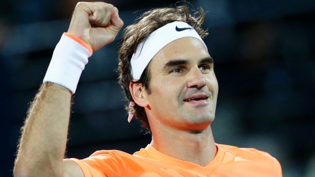 Roger Federer celebrates beating Novak Djokovic at the ATP Championships tennis tournament in Dubai.