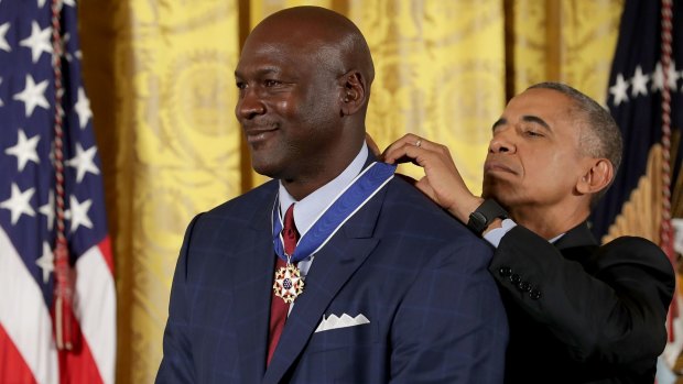 Barack Obama awards the Presidential Medal of Freedom to NBA Hall of Fame member and legendary athlete Michael Jordan.