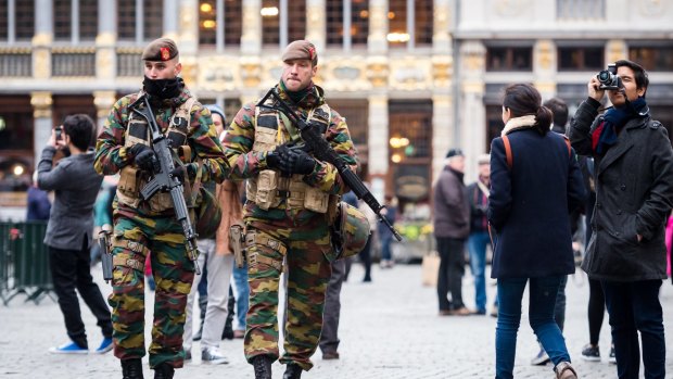 Belgian Army soldiers patrol in the picturesque Grand Place in the centre Brussels as the city goes into lockdown.