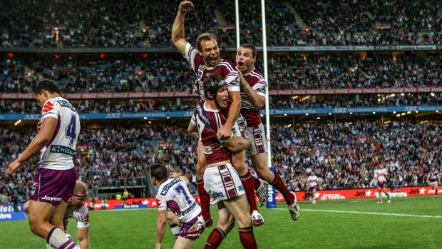 Stewart celebrates Manly's 2008 grand final win over the Melbourne Storm with teammates.