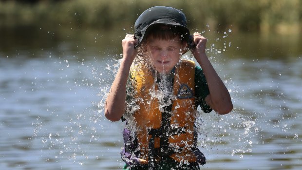 Chapman's Dylan Kirsten, 11, cools off in Lake Burley Griffin.