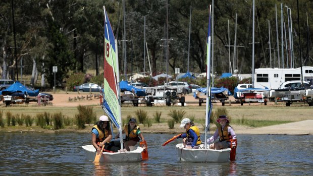 The Canberra Yacht Club's Sailing School Tackers Program has attracted growing numbers each summer. From left, Aneesa Saadat, 11, Poppy Smith, 8, Ingrid Shelton Agar, 9, and Kalea Ford, 9, get on the water this month. 
